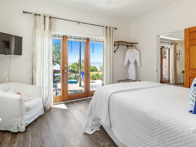 2-BR Dogwood Suite king bedroom with view of Mobile Bay at Jubilee Suites in Fairhope, AL
