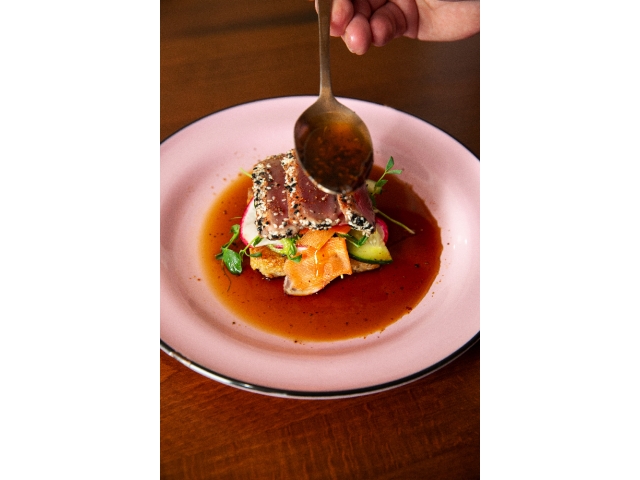Photo of food plate with entree and sauce