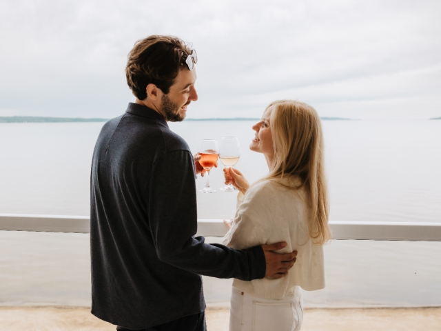 Couple enjoying wine on private balcony