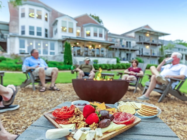 Guest enjoying firepit at Jubilee Suites on Mobile Bay