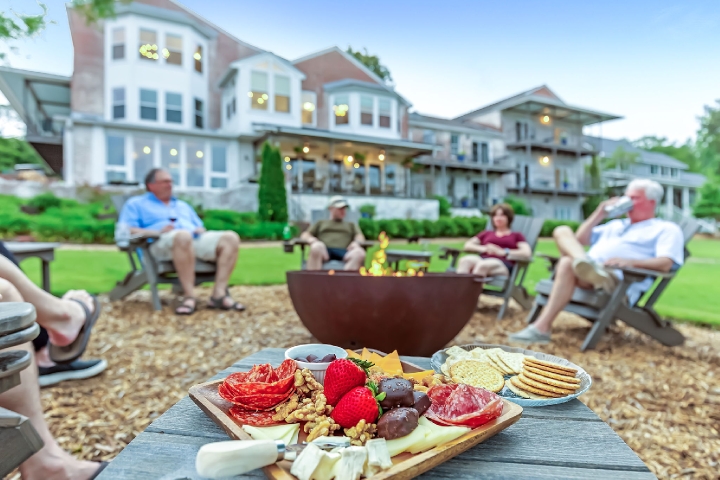 Guest enjoying firepit at Jubilee Suites on Mobile Bay