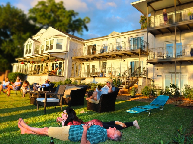 Guests enjoying sunset at Jubilee Suites on Mobile Bay
