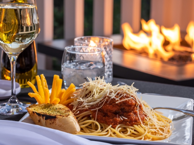 meal of spaghetti in front of a fire place