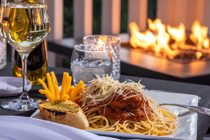 meal of spaghetti in front of a fire place