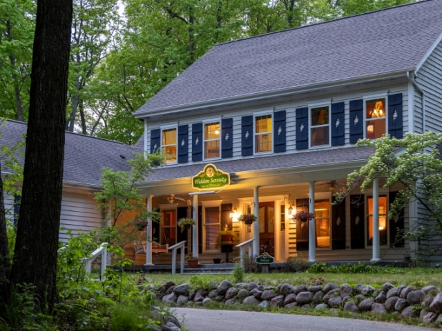 Front exterior of inn at dusk