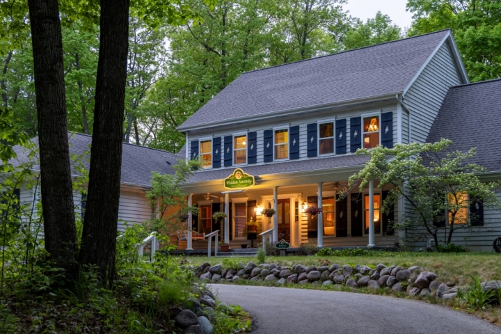 Front exterior of inn at dusk