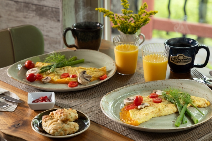plated breakfast with eggs and juice