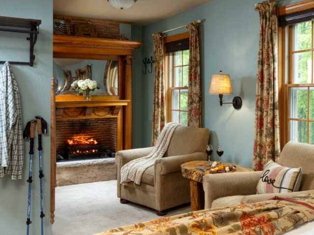 guest room with fireplace and comfortable chairs