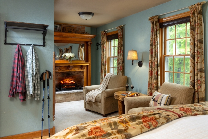 guest room with fireplace and comfortable chairs