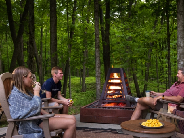 people gathering at fire pit