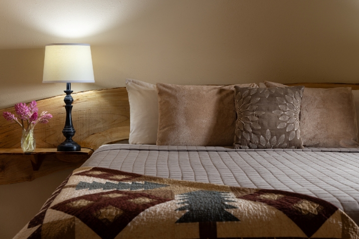 guest room with patterned quilt