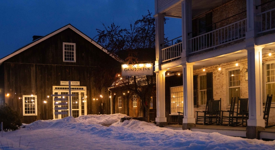 The Grafton Inn at night time in the winter with snow on the ground