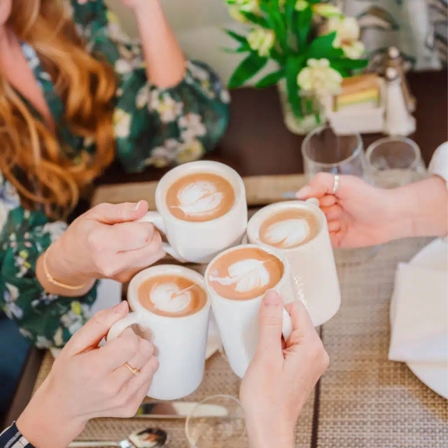 Guests enjoying coffee at the Cuthbert House breakfast.