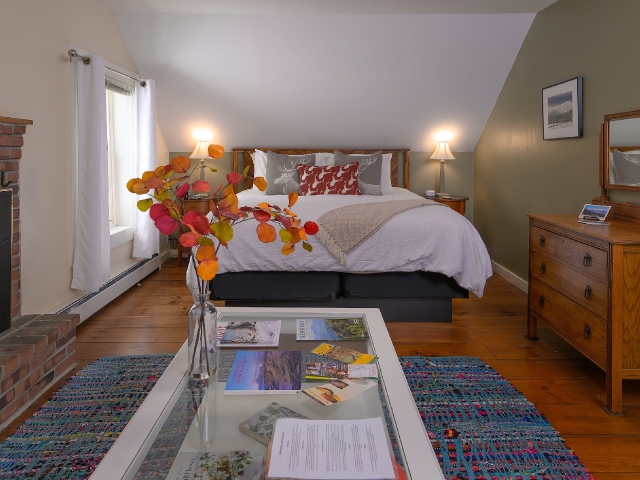 bed and flowers in Mt Mansfield suite