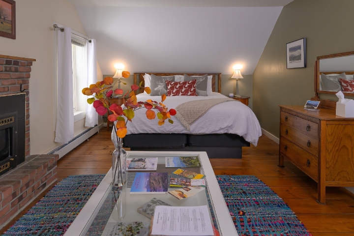 bed and flowers in Mt Mansfield suite