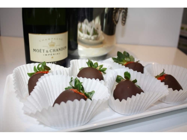 chocotalte covered strawberries and bottle of wine