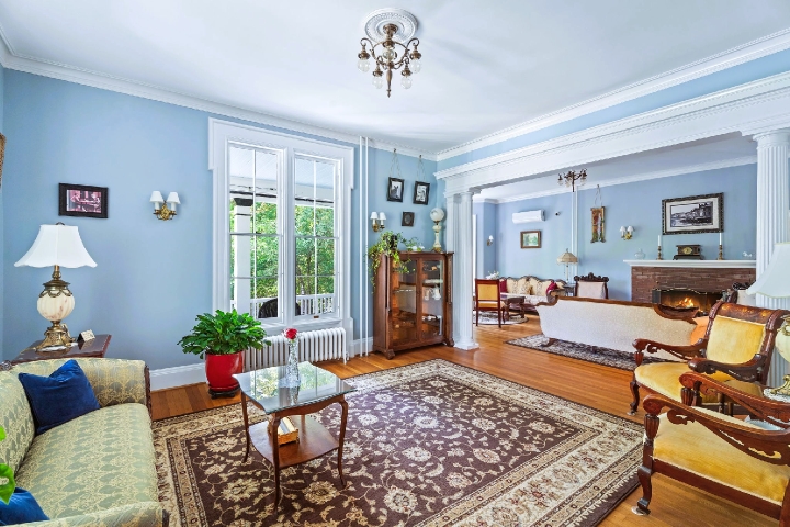 A parlor layered with history, light, and the easy comfort of our 1800s home.