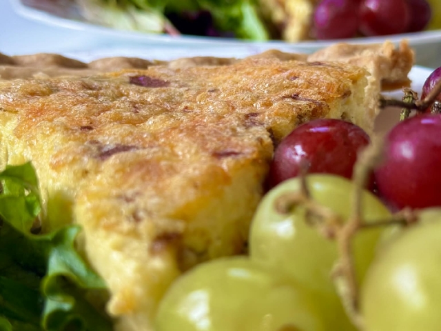 My farm‑fresh quiche, made with eggs and bacon from our local farm partners