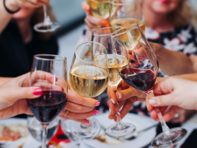 Friends toasting with glass of wine