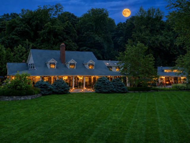 Beautiful Harvest Moon Over The Welsh Hilld Inn at Dusk