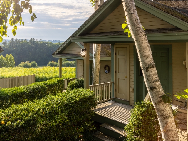 exterior entrance of our cottages on a golden summer evening