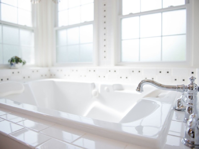The massive air whirlpool bubble massage tub in the Somewhere in Time large bathroom.