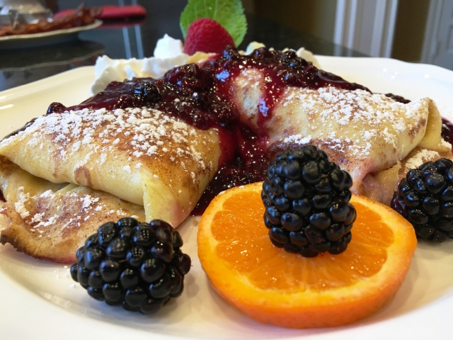 Organic Cream-filled Blintz with Blackberry topping